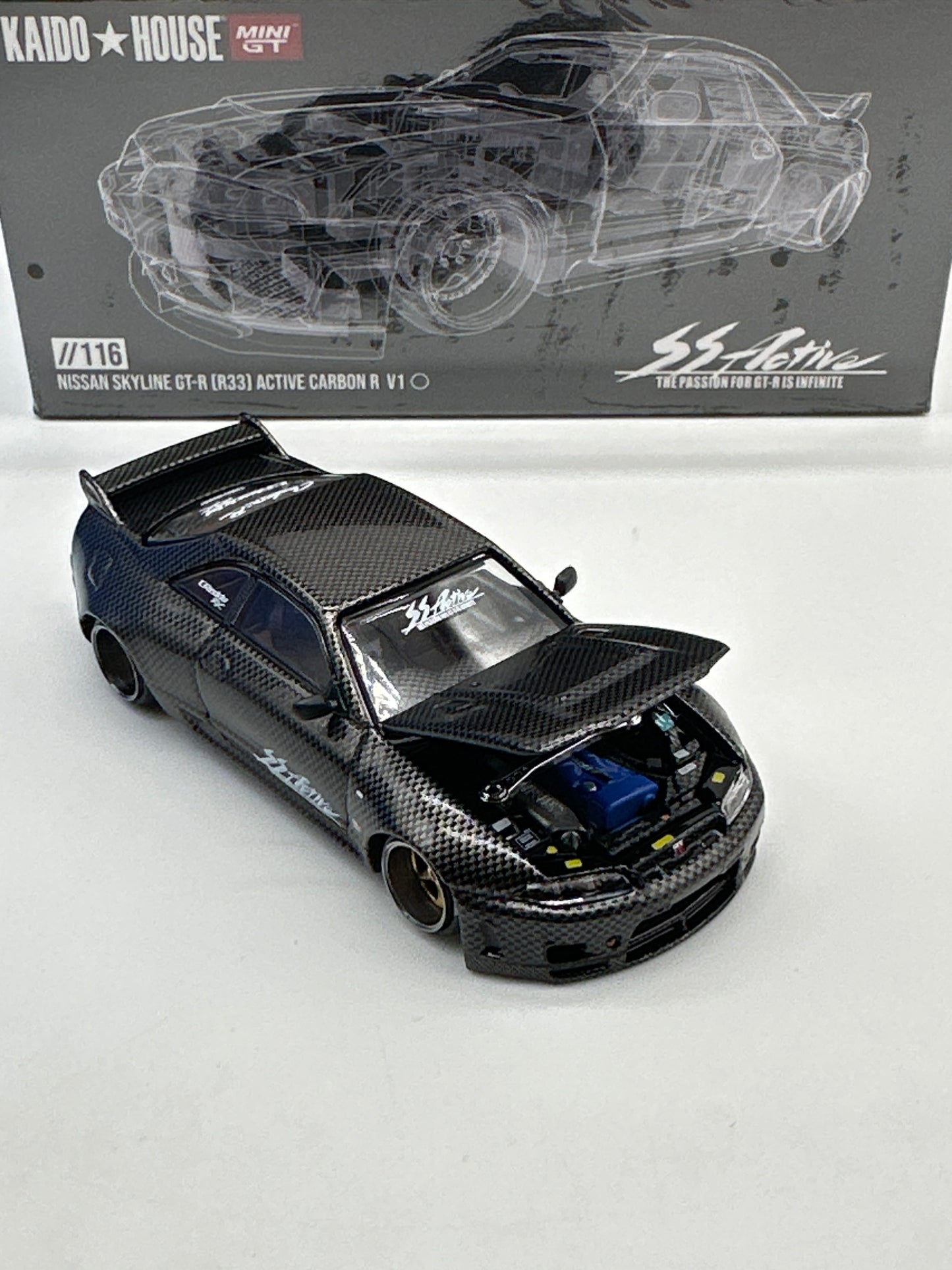 Kaido House (x MiniGT) - Regular Release #116 - Nissan Skyline GT-R (R33) Active Carbon R V1