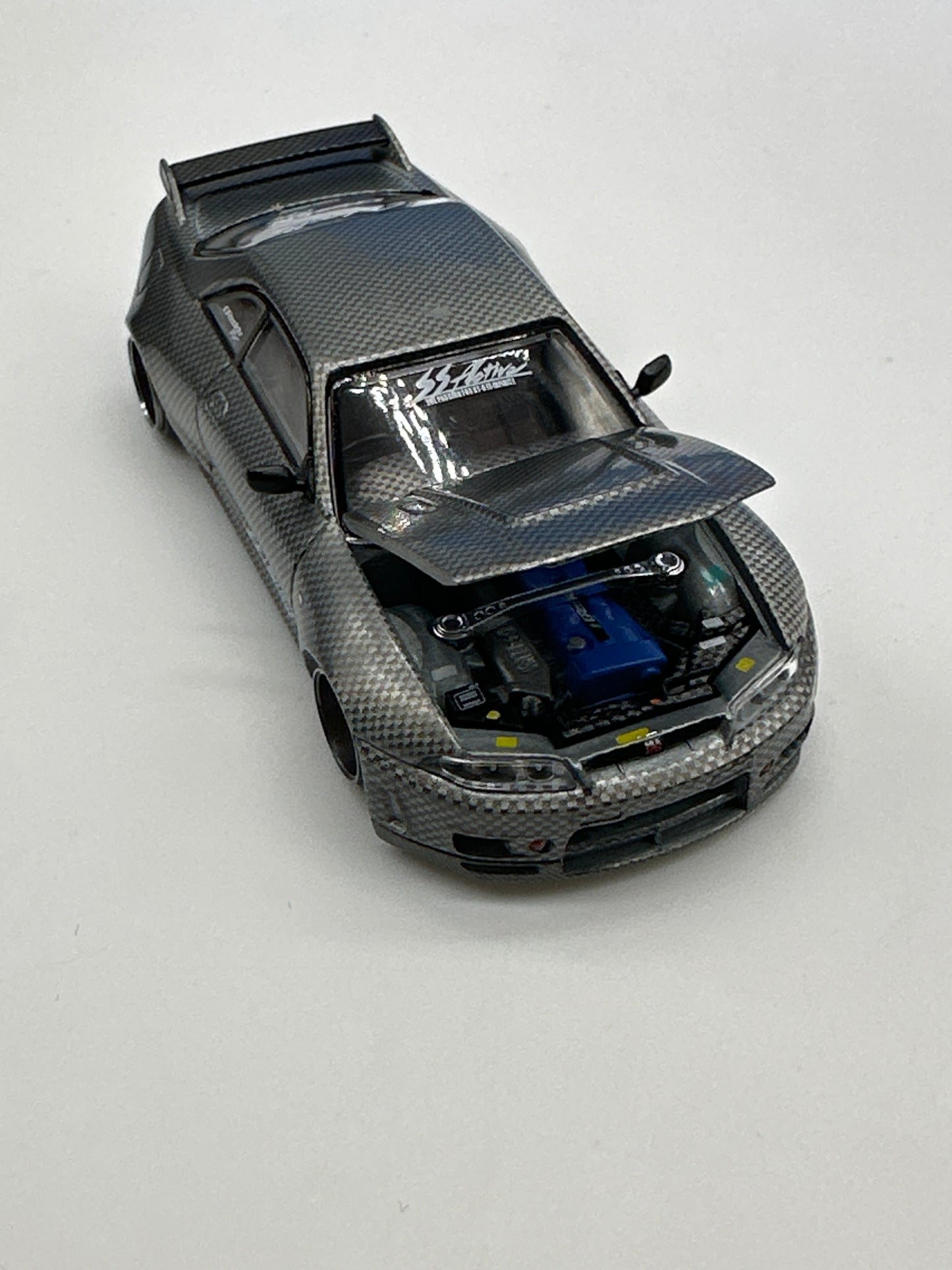 Kaido House (x MiniGT) - Raw Chase Release #116 - Nissan Skyline GT-R (R33) Active Carbon R V1