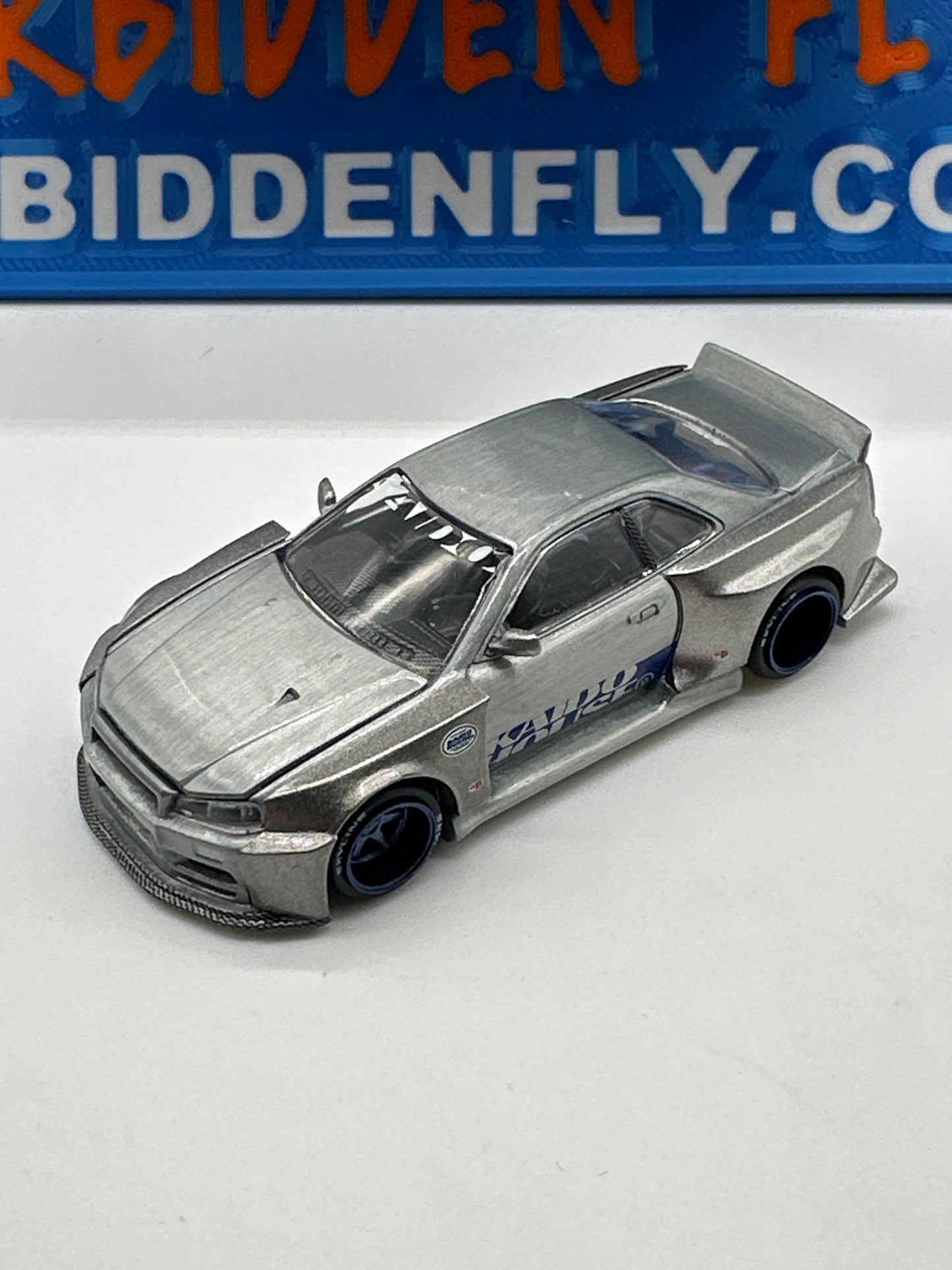 Kaido House (x MiniGT) - Raw Chase #143 - Nissan Skyline GT-R (R34) Kaido Works Shinjuku V1