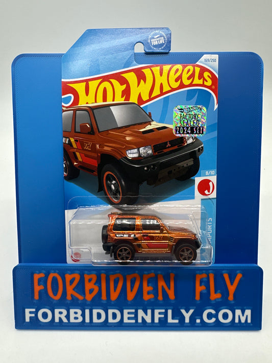 Hot Wheels 2024 J Case Super Treasure Hunt - Factory Stickered - Mitsubishi Pajero Evolution