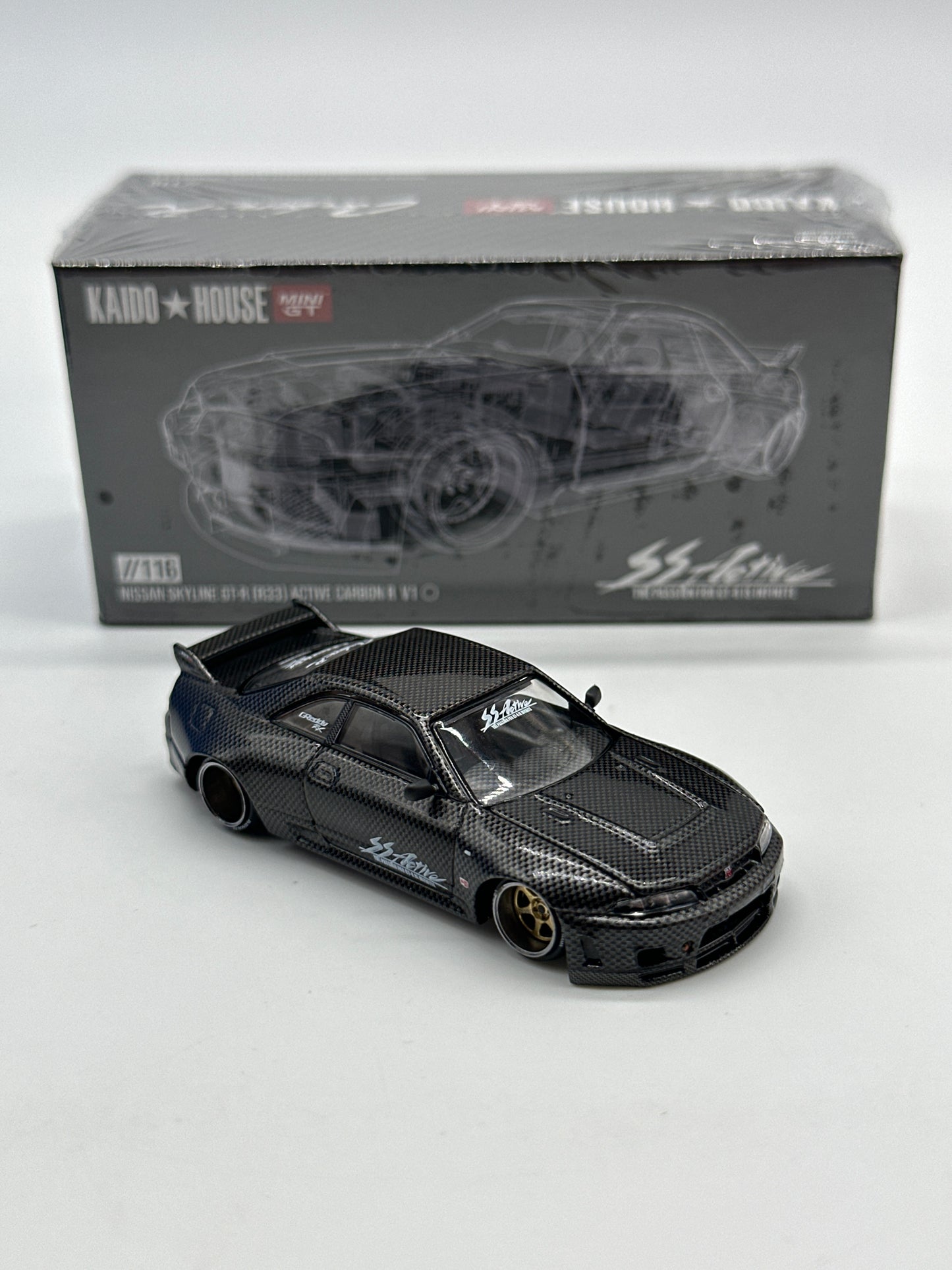 Kaido House (x MiniGT) - Regular Release #116 - Nissan Skyline GT-R (R33) Active Carbon R V1