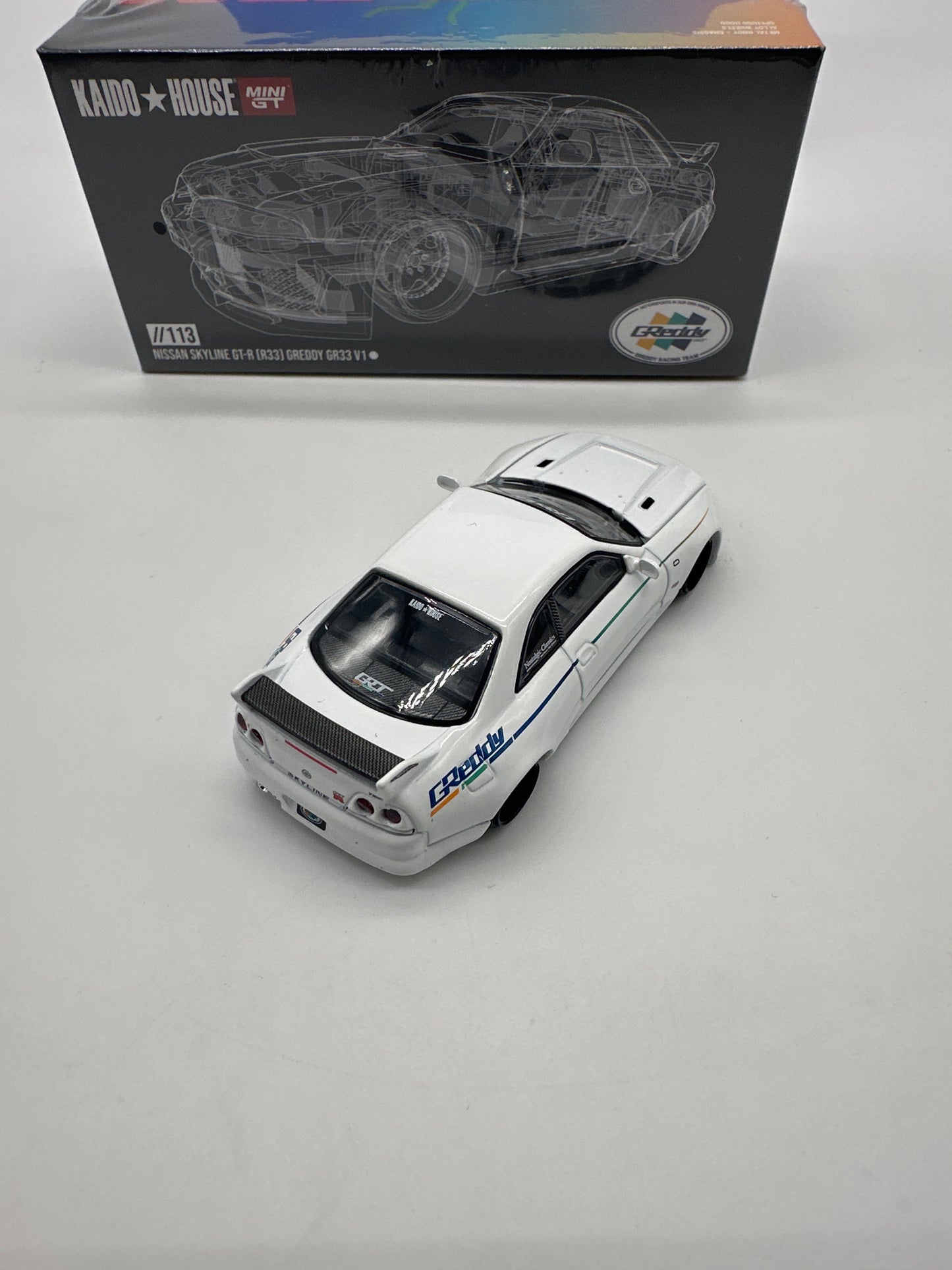 Kaido House (x MiniGT) - Regular Release #113 - White Nissan Skyline GT-R (R33) GReddy V1