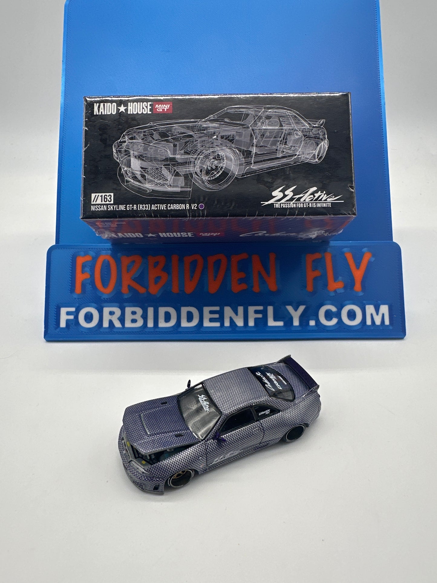 Kaido House (x MiniGT) - Raw Chase #163 - Nissan Skyline GT-R (R33) Active Carbon R V2