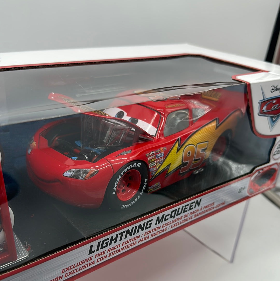 Jada 1:24 Scale - Disney Pixar Cars Deluxe - Exclusive Tire Rack Edition Lightning McQueen